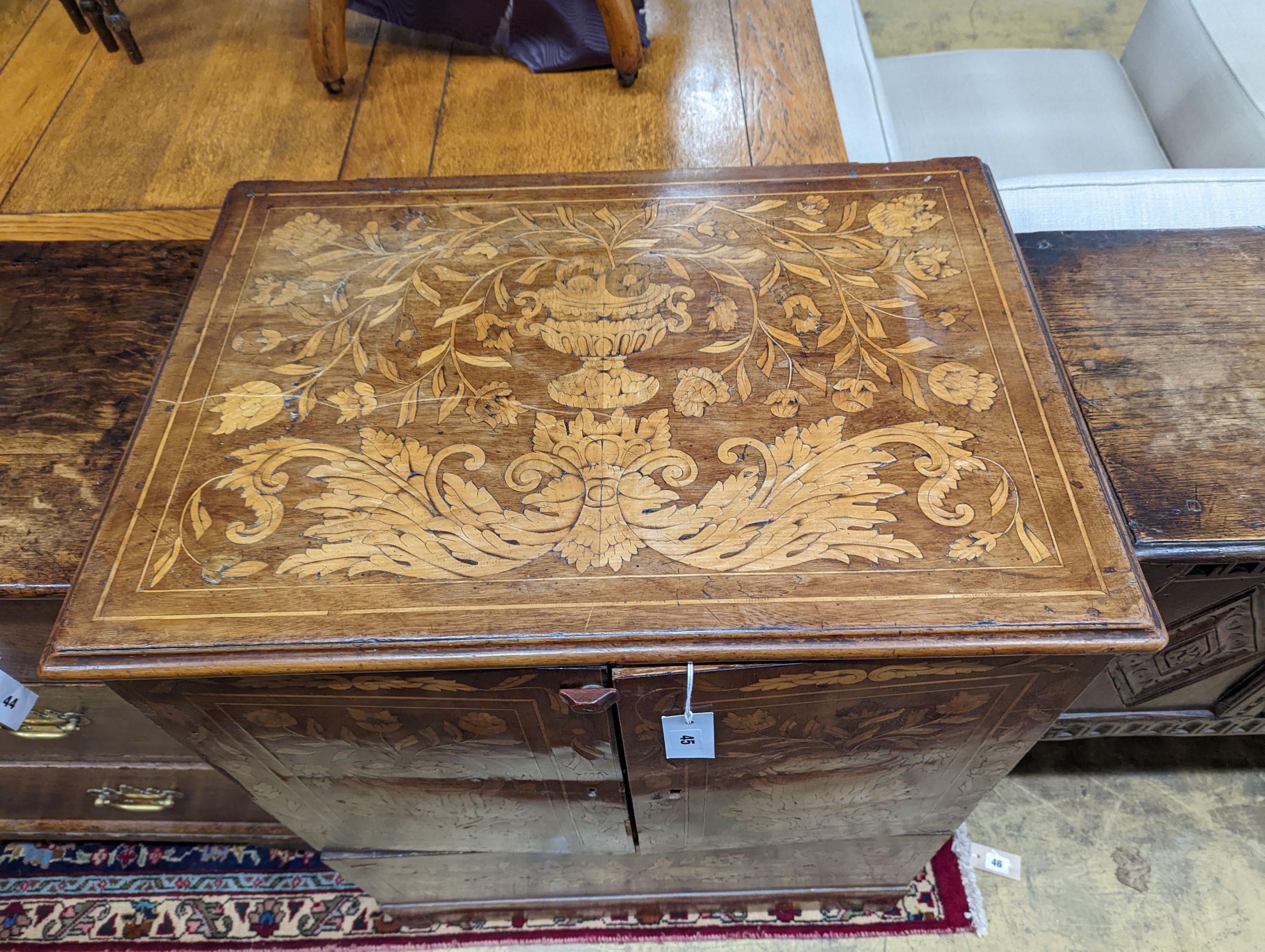 An 18th century Dutch floral marquetry walnut cabinet (altered), width 70cm, depth 48cm, height 87cm